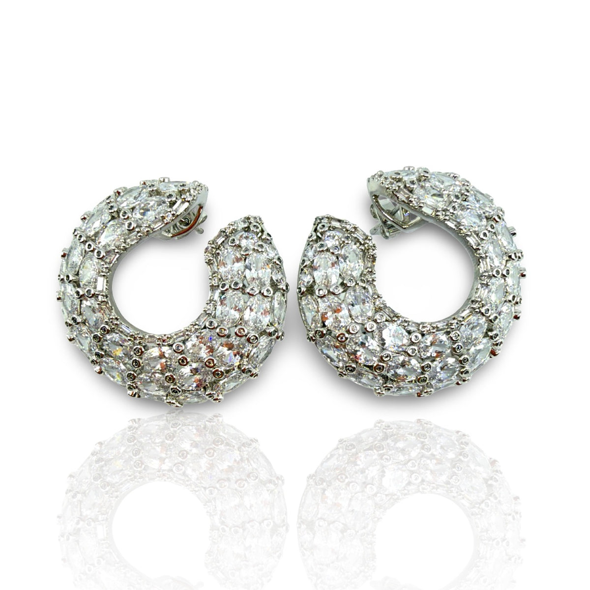 Celeste Pavé Crescent Hoop Earrings — pair on white