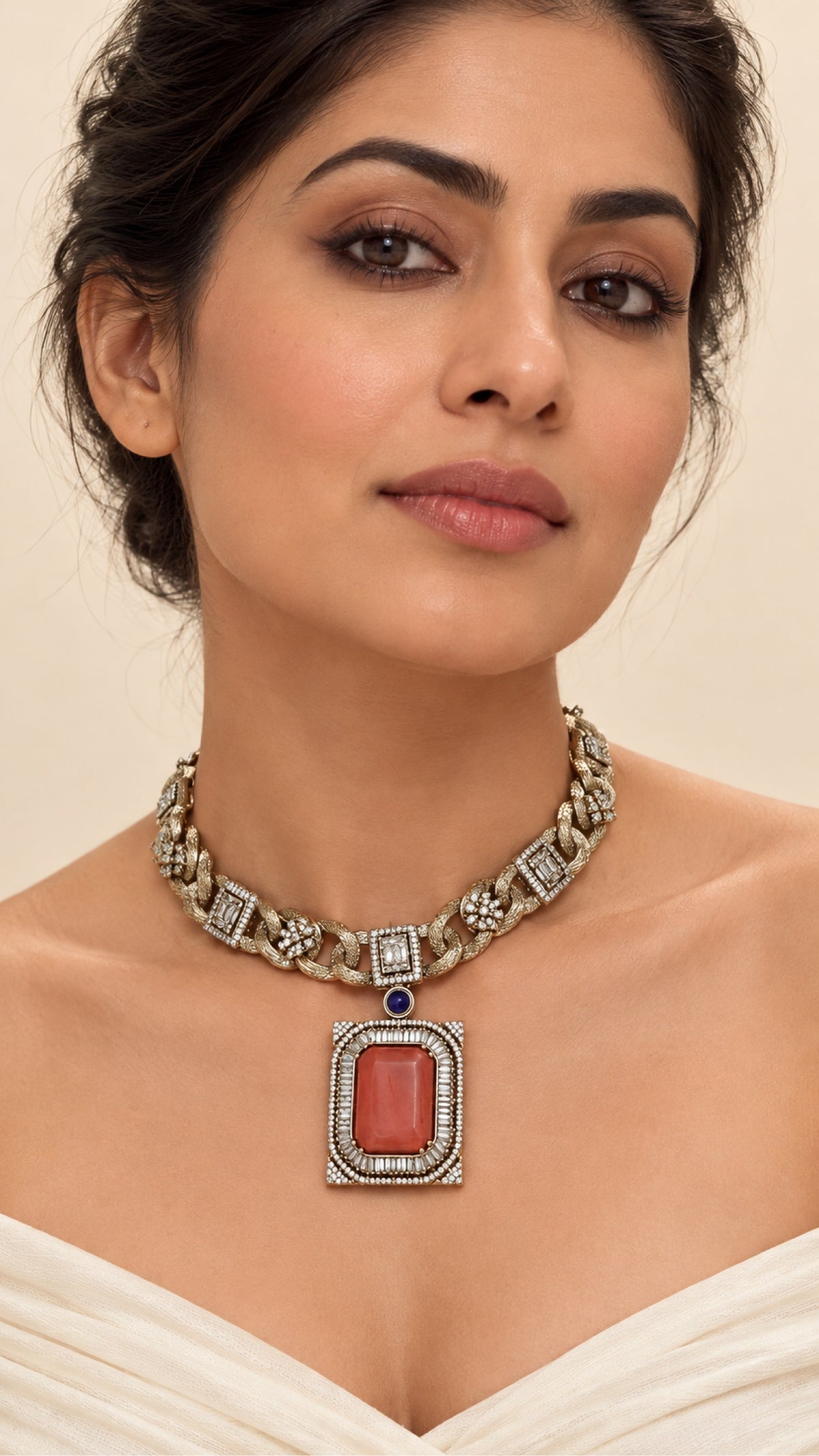 Model wearing the coral pendant link necklace, close-up
