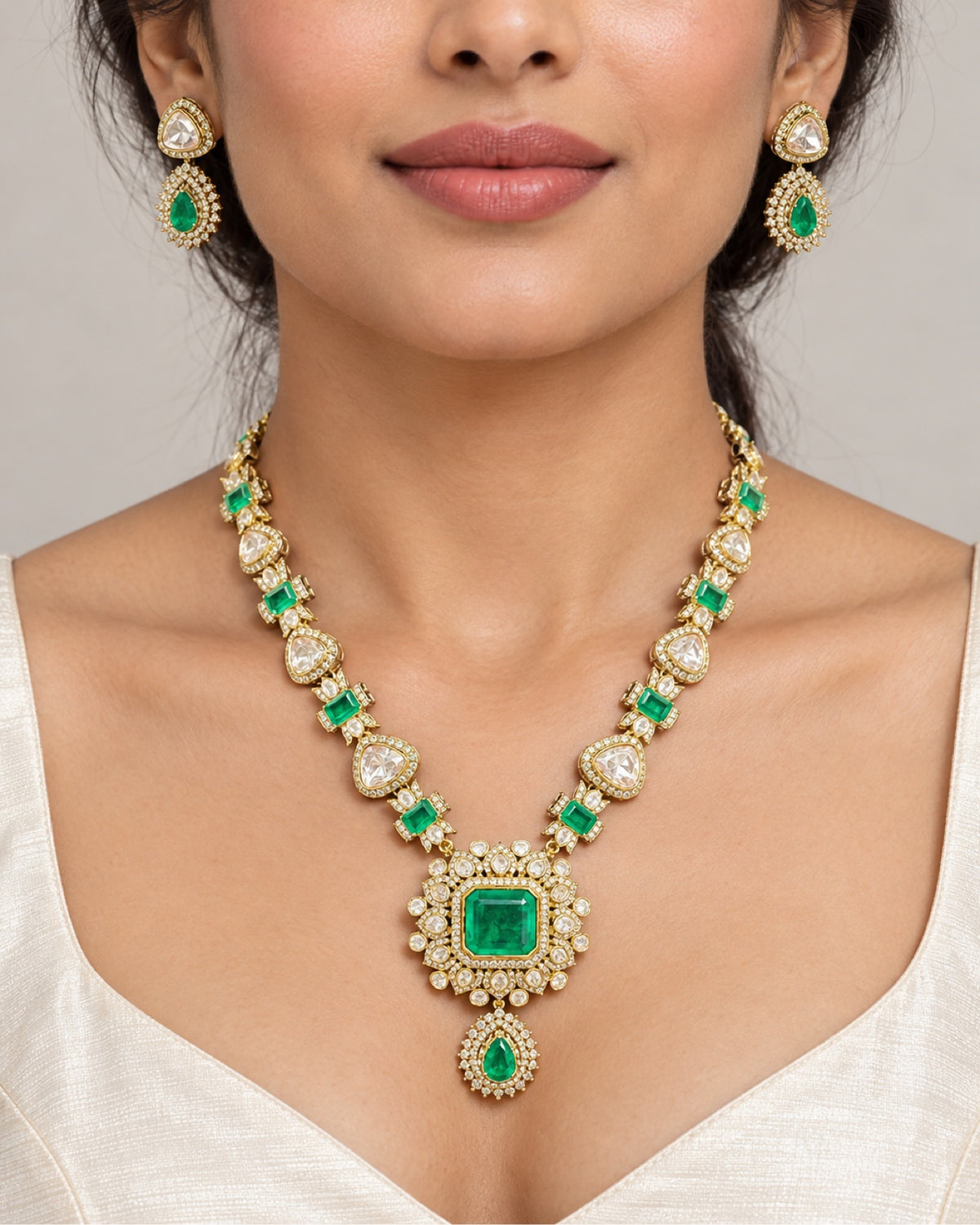 Emerald Polki Pendant Set worn on model, close-up