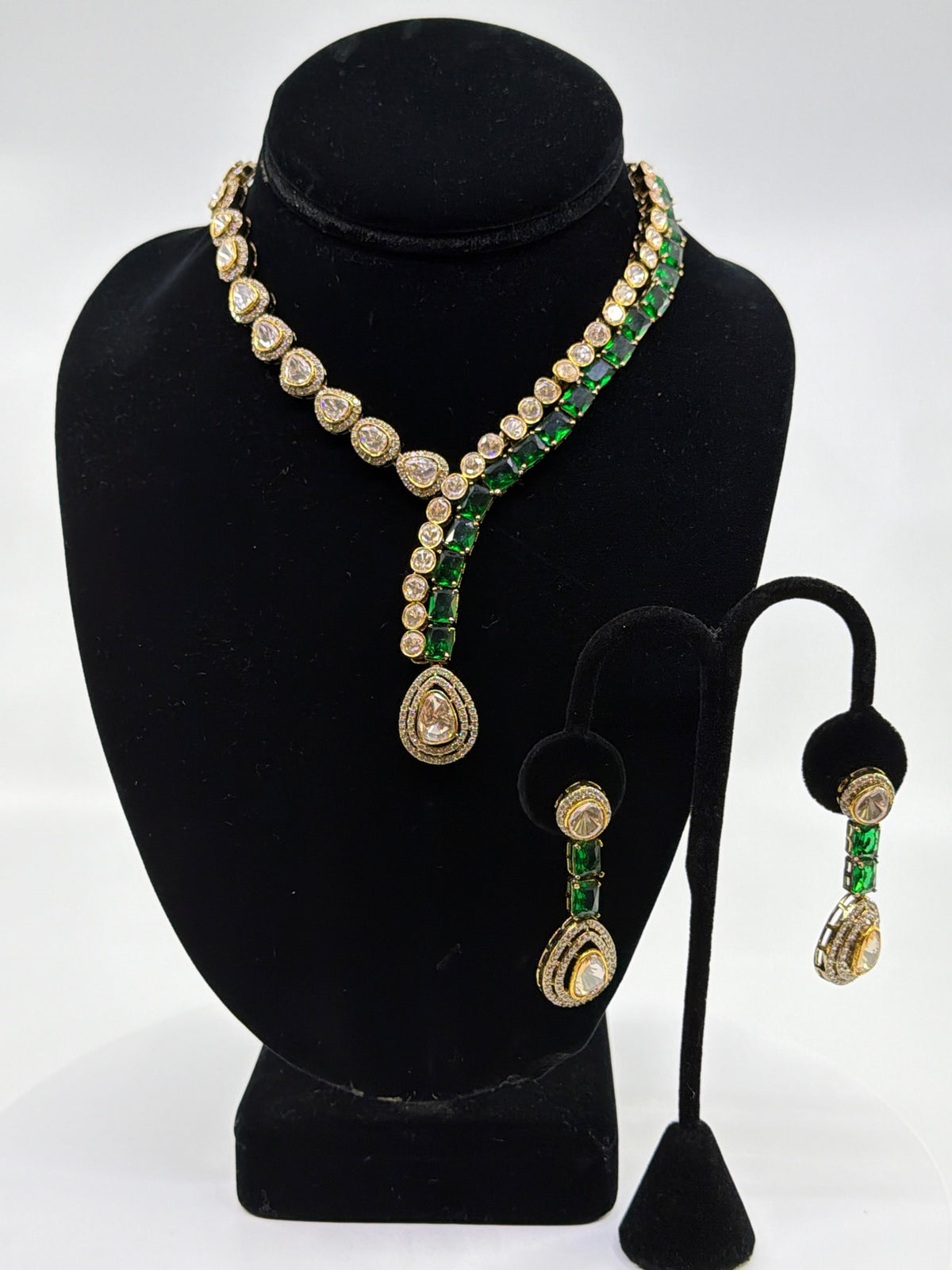 Emerald Polki Y-Neck Set necklace and earrings on clean background