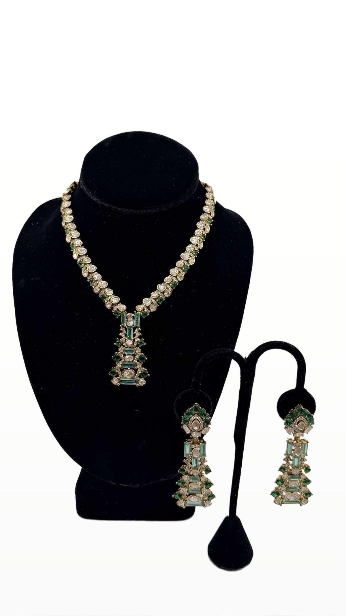 Emerald Tier Polki Set necklace and earrings on clean background