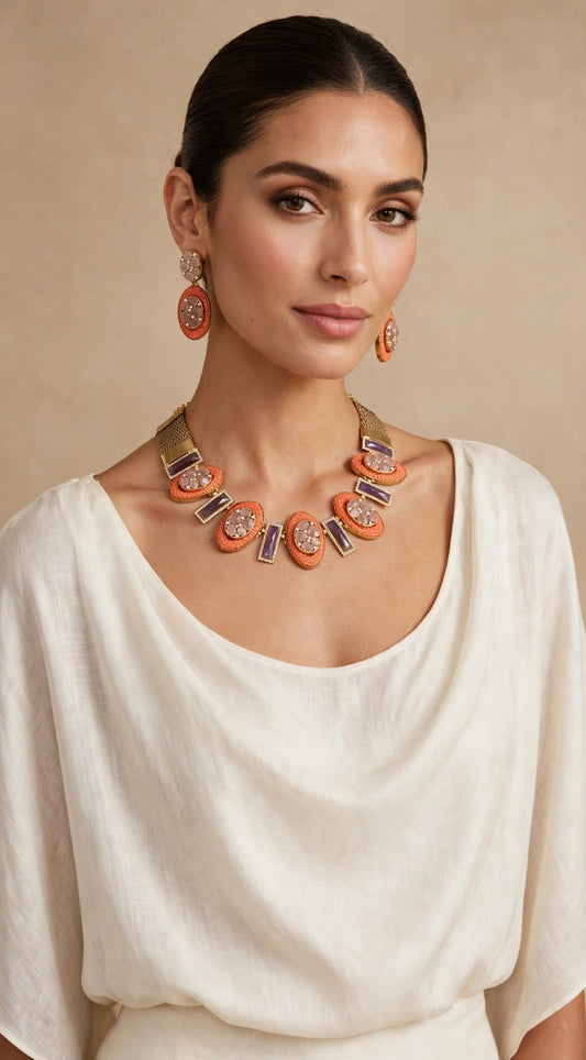 Model wearing the coral blush oval necklace set with an off-white outfit