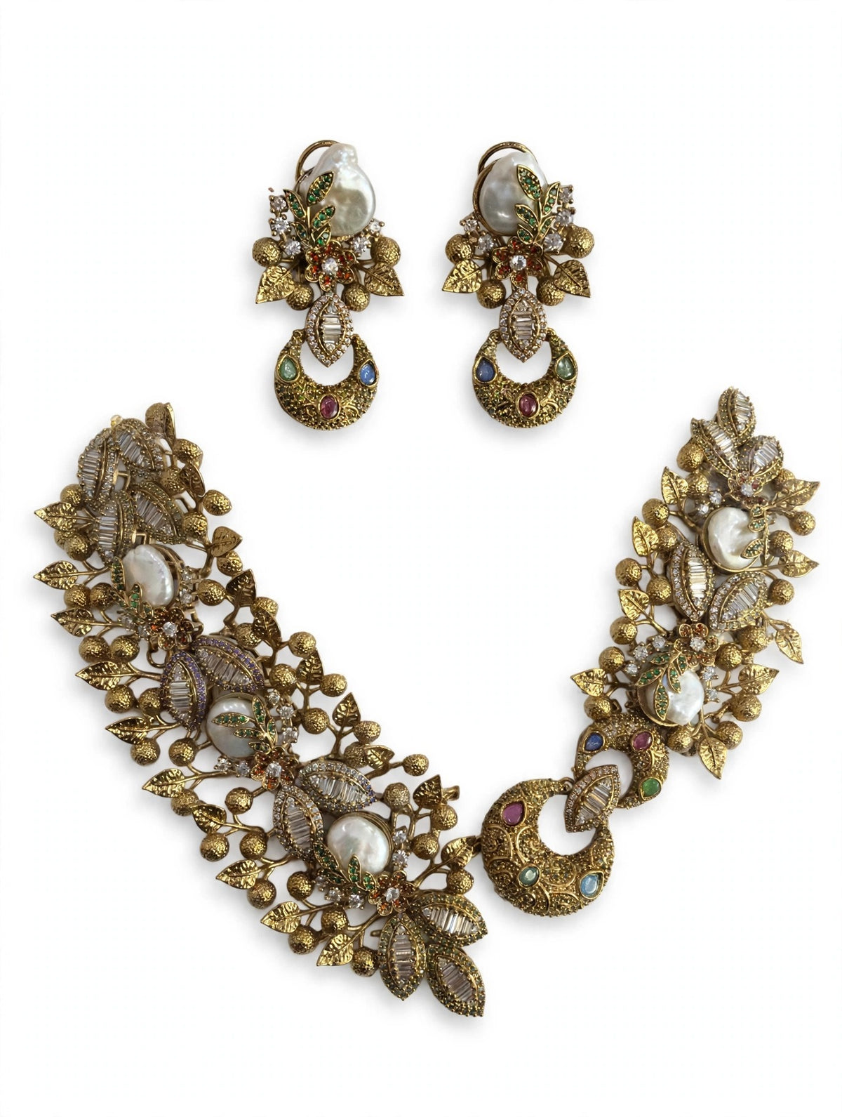 Baroque pearl leaf necklace and matching earrings on a white background